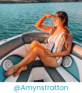 Lady wearing striped swimwear on a boat