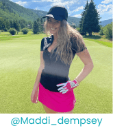 Sporty woman wearing zippered top and skort in a field