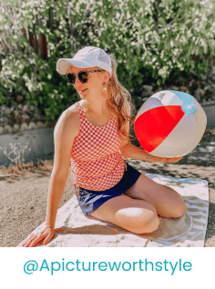 Woman in a tankini holding a beach ball