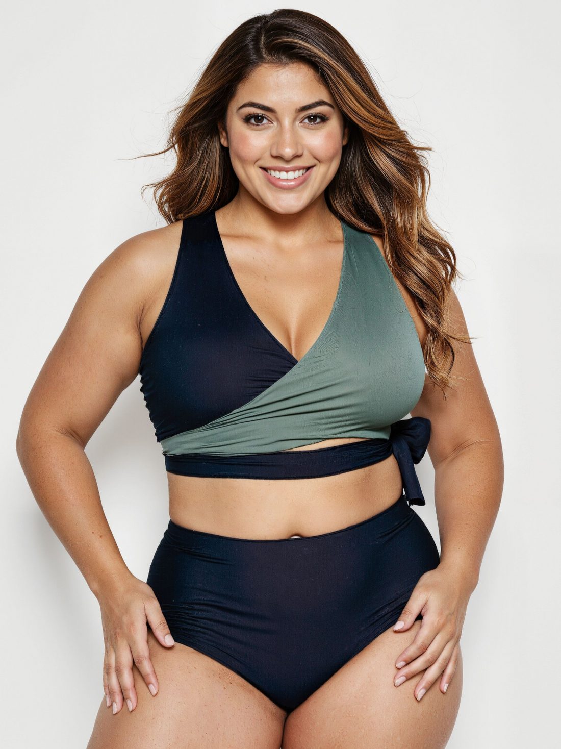 Woman wearing a two-tone bikini with a white background