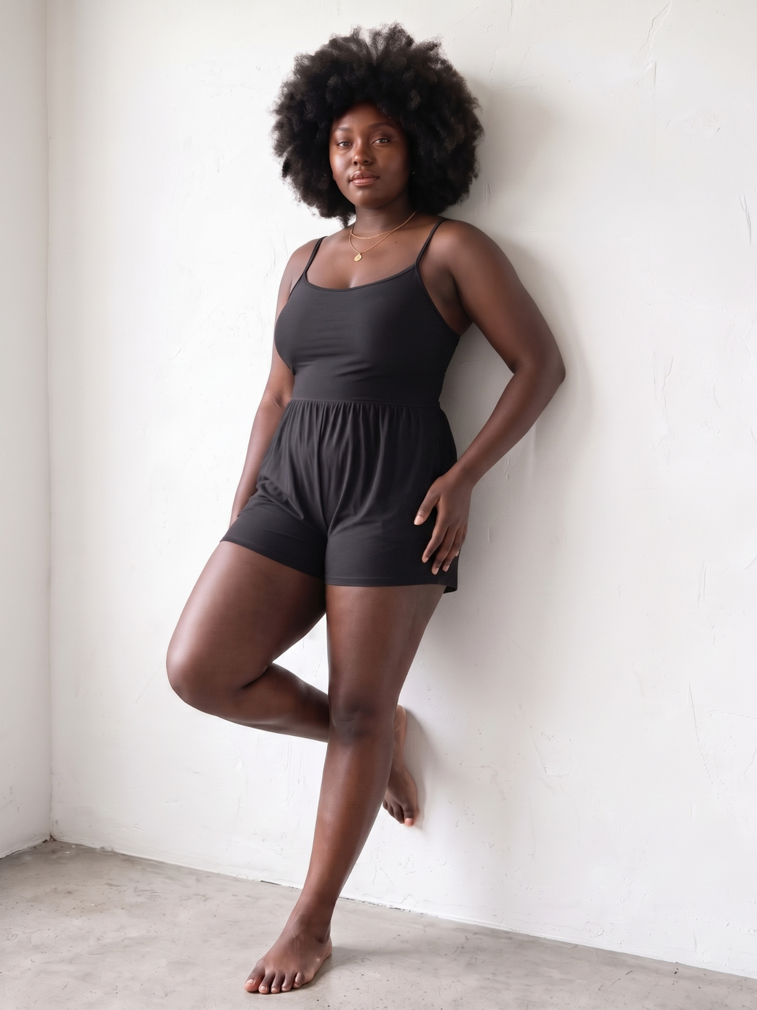 Ivy Swim Romper | Plus Size in black on a plus size model offering modest supportive swimwear and a comfortable fit for every body