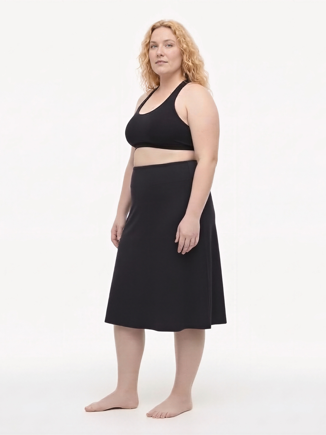 Black Long Swim Skort With Capri Leggings | Plus Size shown on a model with modest supportive swimwear and a comfortable fit designed for every body